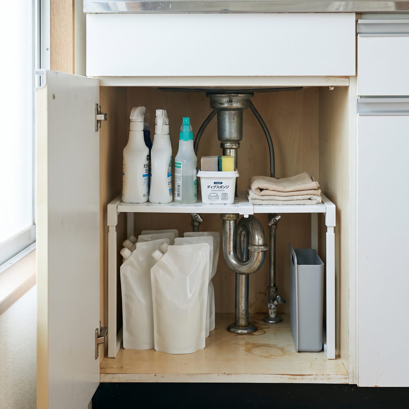 Add a Riser Shelf That Works Around Under-Sink Plumbing
