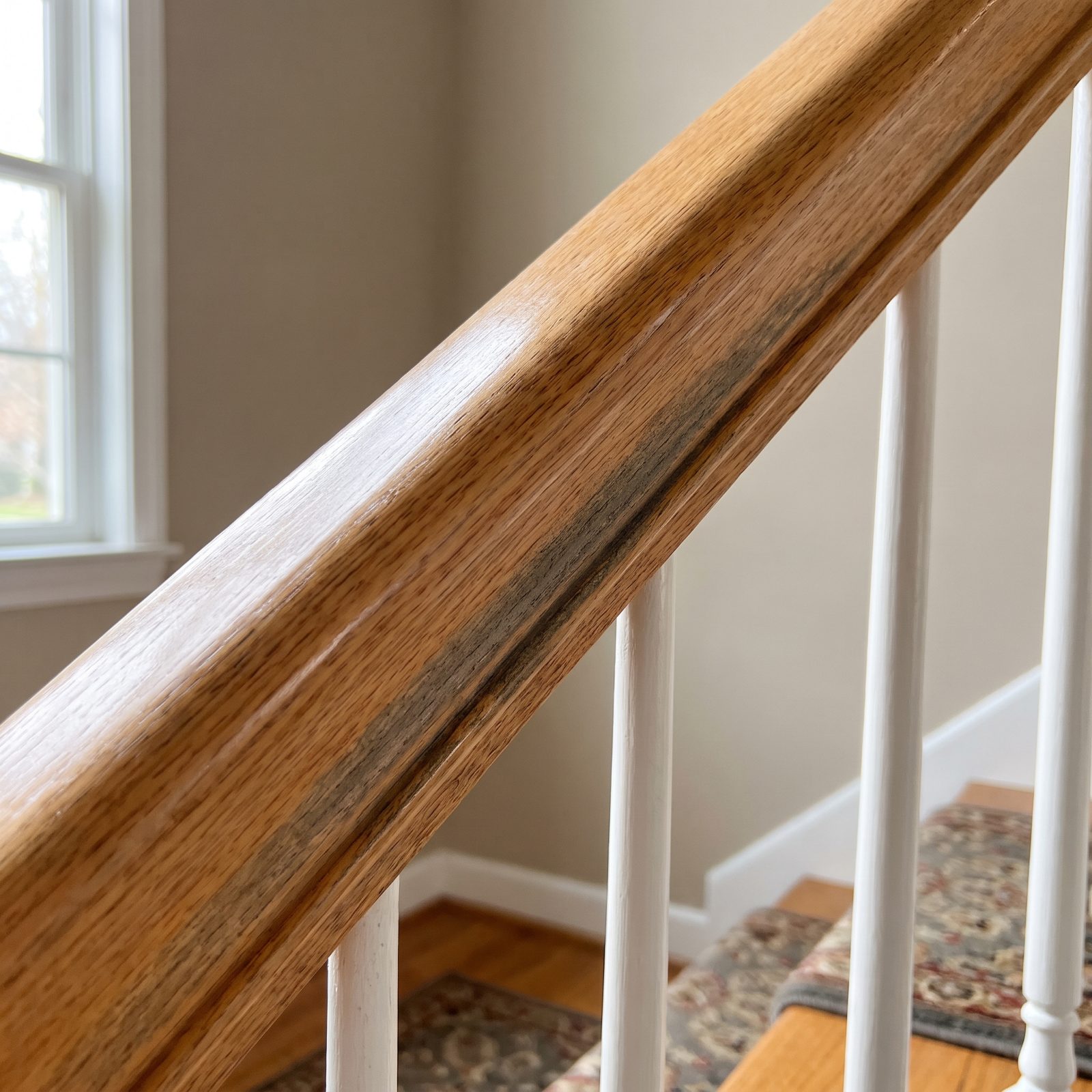 A Darkened Handrail Underside Reveals the Main Grip Zone