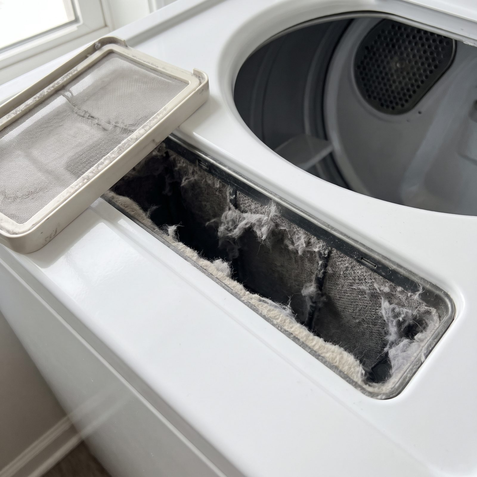 The Dryer Lint-Screen Slot, Escaped Lint Collects Below the Filter