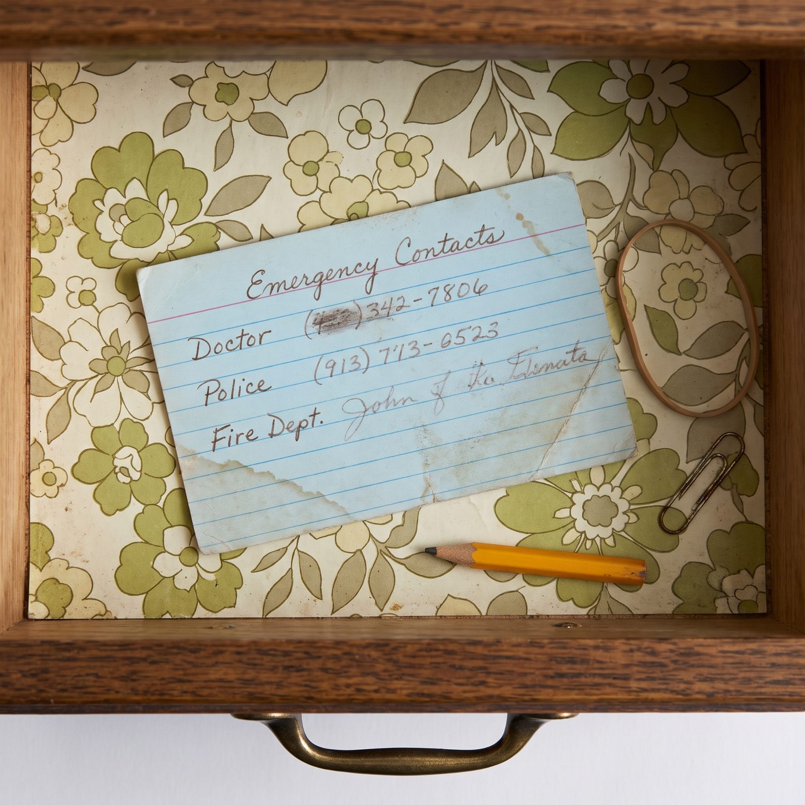 A Handwritten Card Listing the Doctor, Police, and Fire Department Numbers