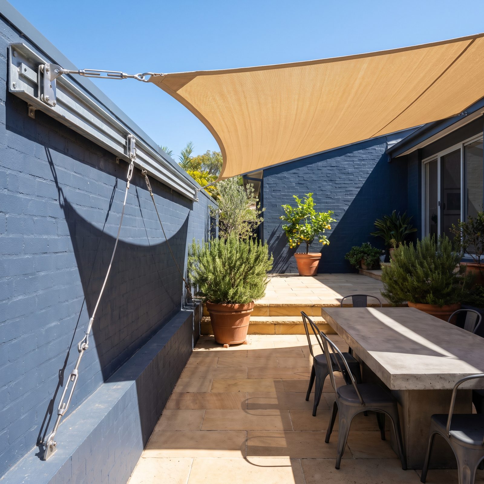 A Track-Mounted Shade Sail You Can Reposition by Hand